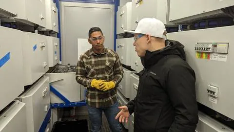 Inside a Smartbox container, electrical work with the team