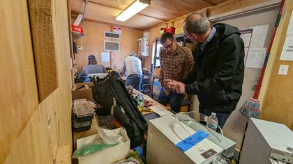 Aviran Vargas reviewing network gear at a bitcoin mining facility